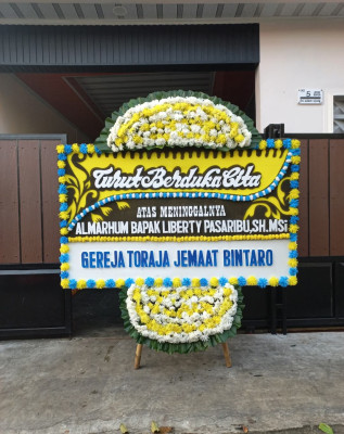 Papan Bunga Duka di Parado